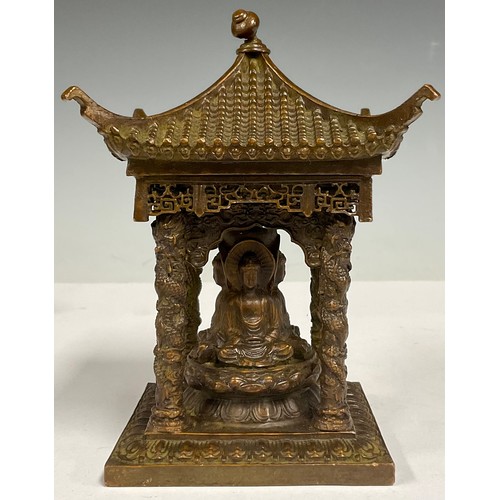 73 - A Chinese bronze pagoda temple, with four seated Buddha, 10.5cm square, 14cm high