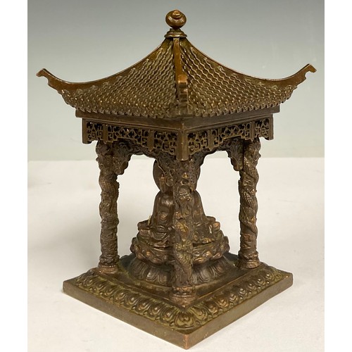 73 - A Chinese bronze pagoda temple, with four seated Buddha, 10.5cm square, 14cm high