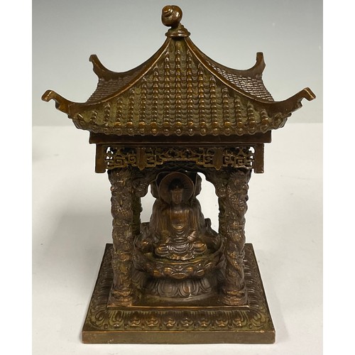 73 - A Chinese bronze pagoda temple, with four seated Buddha, 10.5cm square, 14cm high