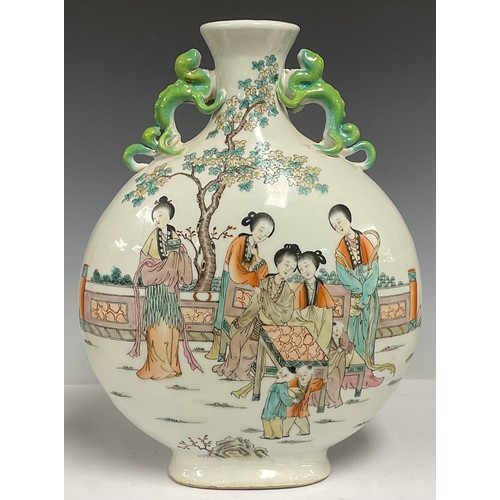 77 - A Chinese ceramic twin handled moon flask, enamel decorated with ladies and children in a garden, in... 