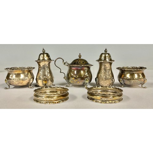 85 - A George V silver composed five-piece condiment set, Birmingham and Sheffield hallmarks, c.1916; a p... 