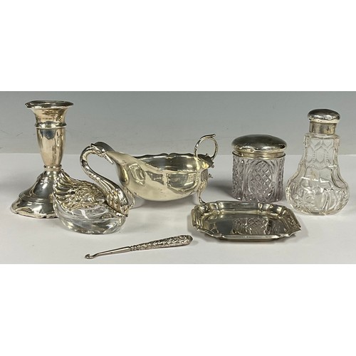 94 - A George V silver cream jug, Birmingham 1910; a 925 silver mounted novelty inkwell, as a swan; other... 