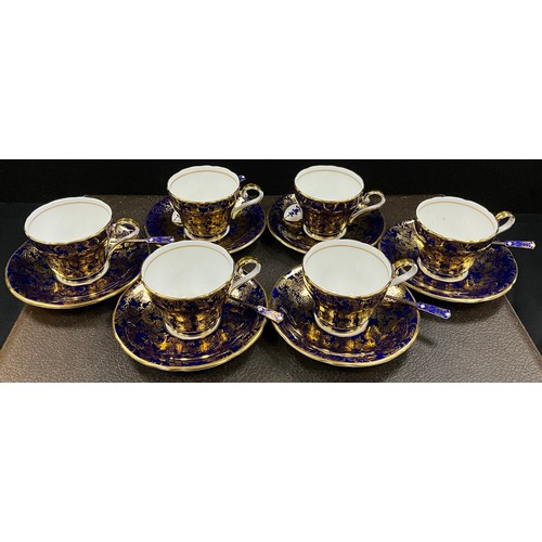 5 - A set of six Aynsley colbalt blue and gilt coffee cups and saucers conforming silver and enamel spoo... 