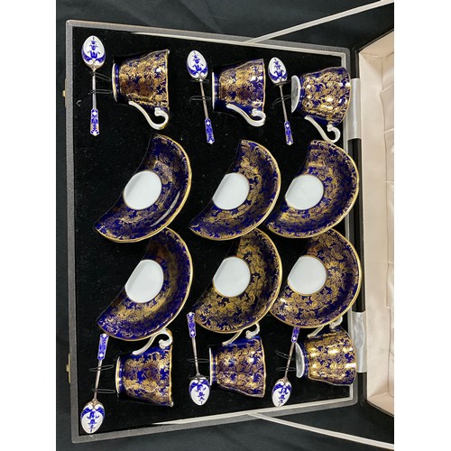 5 - A set of six Aynsley colbalt blue and gilt coffee cups and saucers conforming silver and enamel spoo... 