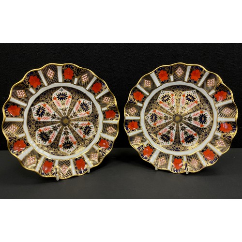 8 - A pair of 1128 imari pattern wavy rim plates, 21.7cm diameter, both firsts, (2).