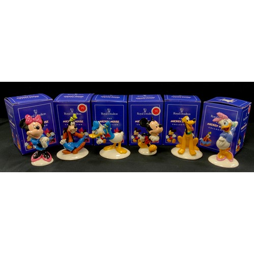 56 - Royal Doulton from The Mickey Mouse collection including; Mickey Mouse, Minnie Mouse, Goofy, Donald ... 