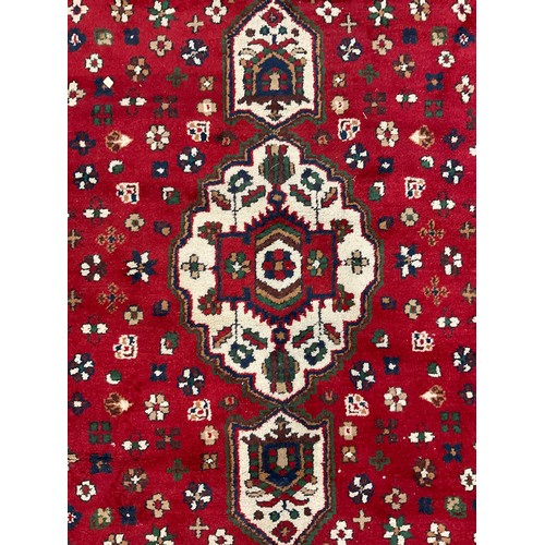 108 - A Persian Hamadan type rug, hand-knotted with central lobed medallion, within a field of stylised fl... 