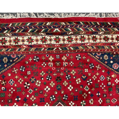 108 - A Persian Hamadan type rug, hand-knotted with central lobed medallion, within a field of stylised fl... 