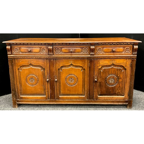 115 - A carved oak sideboard, early 20th century, 91.5cm high x 168cm wide x 50.5cm deep.