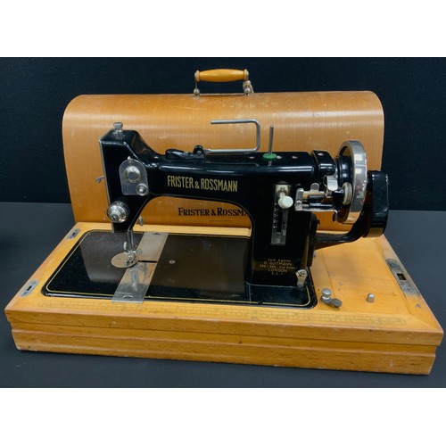 183 - A Vintage Frister Rossman sewing machine, wooden case.