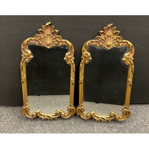 220 - A pair of 20th century baroque style wall mirrors, scrolling foliate gilt frames, approx 75cm x 55cm... 