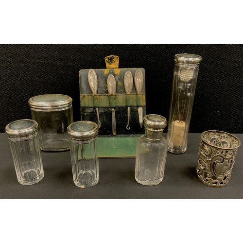 265 - Silver - silver topped dressing table jars and button hooks, decorated with swags and bows, Birmingh... 