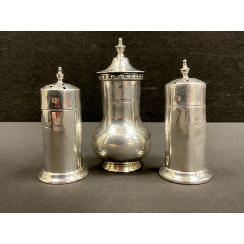 274 - A Walker & Hall silver pepper pot, Sheffield 1928; another pair marks worn, 106g gross (3)