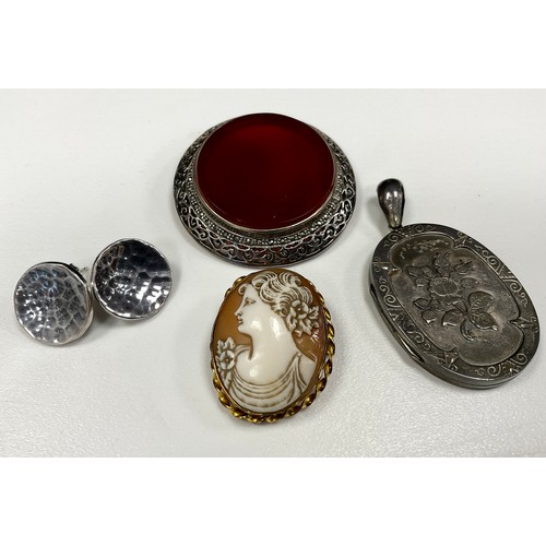 285 - A Victorian silver oval locket pendant, Birmingham 1886;  carnelian brooch, pair of silver earrings,... 