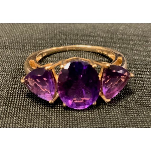 311 - A 9ct gold amethyst dress ring, stamped 10k, TGGC, 417, size N, 2.7g gross.