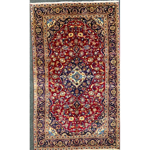 137 - A Central Persian Kashan Rug, hand-knotted with a central diamond-shaped medallion, within a densely... 