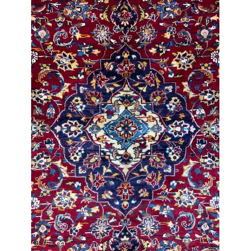 137 - A Central Persian Kashan Rug, hand-knotted with a central diamond-shaped medallion, within a densely... 