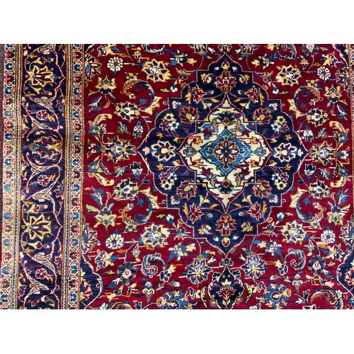 137 - A Central Persian Kashan Rug, hand-knotted with a central diamond-shaped medallion, within a densely... 