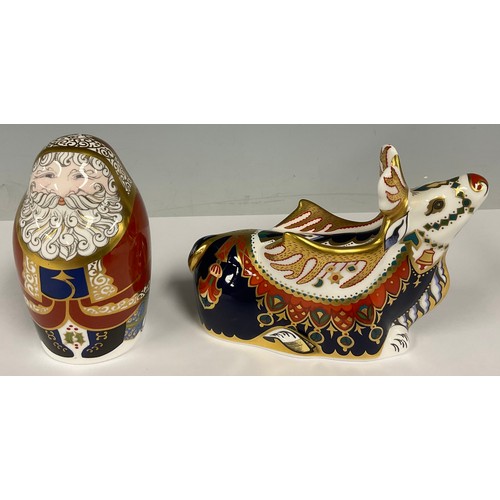 13 - A Royal Crown Derby paperweight, Santa Claus in the form of a Russian doll, gold stopper; another,  ... 