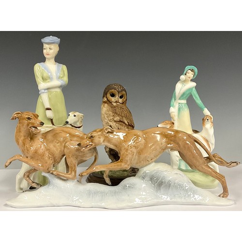 111 - A German Rosenthal Classic Rose porcelain model, of two racing greyhounds, after Fritz Heidenreich, ... 