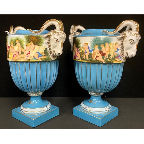 100 - A pair of large Continental porcelain two handled pedestal vases, banded with a classical scene, on ... 