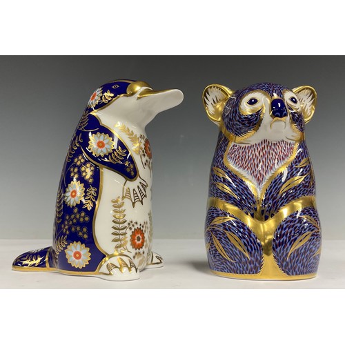 21 - A Royal Crown Derby paperweight, Platypus, gold stopper; another, Koala, gold stopper (2)