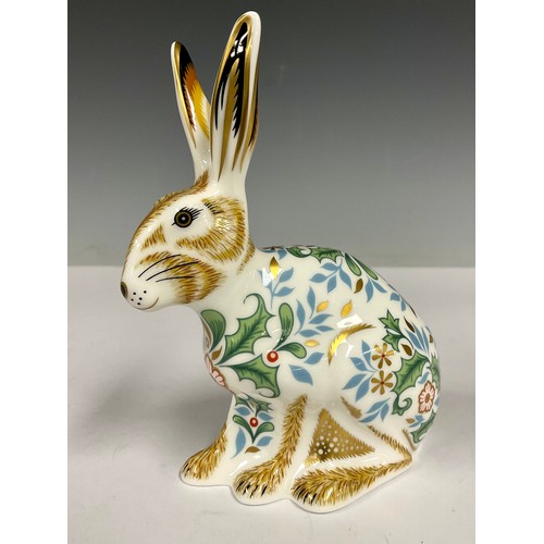 33 - A Royal Crown Derby paperweight, Winter Hare, 13cm high, printed marks in grey, gold stopper