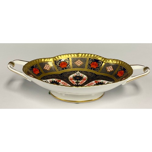 6 - A Royal Crown Derby 1128 old Imari solid band twin handled oval footed bowl, 22.4cm long, printed ma... 