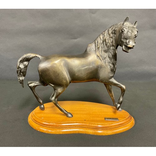 42 - R. Velez (20th century), a contemporary bronzed metal sculpture, of a horse, shaped wooden base, 28c... 