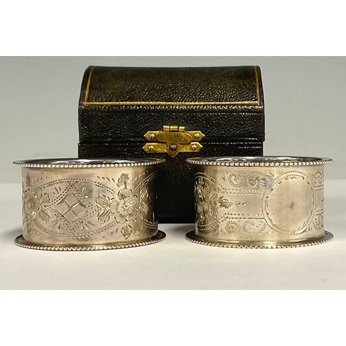 69 - A pair of silver napkin rings, boxed