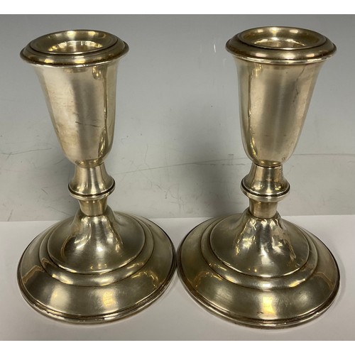 73 - A pair of American silver candlesticks