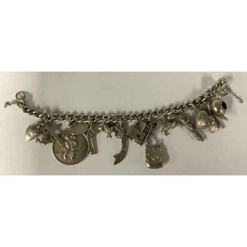 77 - A silver charm bracelet