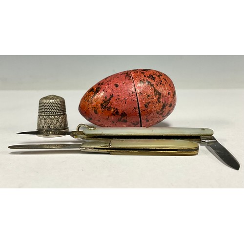 78 - A mother of pearl penknife, hallmarked silver blade; another ; a hallmarked silver thimble in egg ca... 