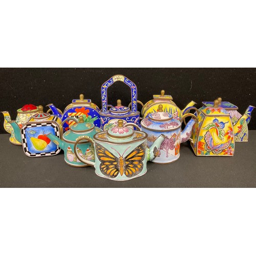 93 - A collection of Trade Aid miniature enamel teapots, decorated in polychrome, with various subjects, ... 