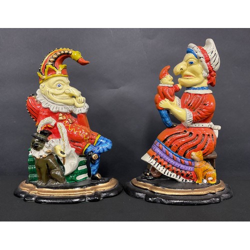 96 - A pair of cast iron novelty doorstops or porters, as Punch and Judy, painted in polychrome, 30cm hig... 