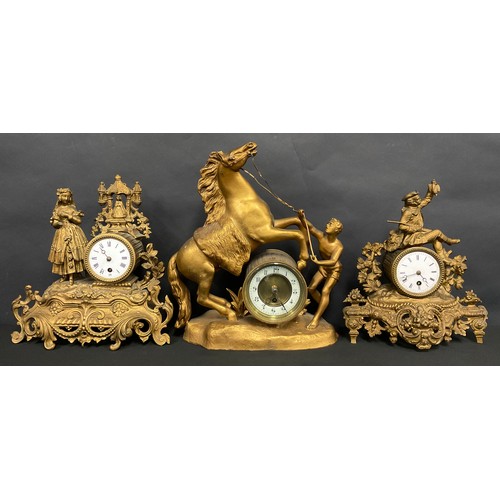 99 - A 19th century French gilt metal mantel clock, c.1890; others (3)