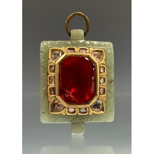 589 - A diamond, jade and foil backed ruby red coloured tablet pendant, the central octagonal red panel, s... 