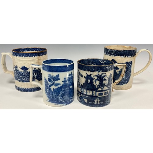 1264 - An early 19th century pearlware blue and white transfer printed Cider mug,  decorated in the Tall La... 