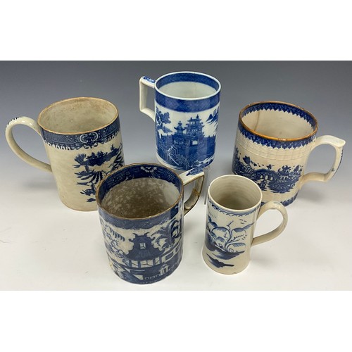 1264 - An early 19th century pearlware blue and white transfer printed Cider mug,  decorated in the Tall La... 