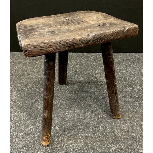 1927 - An 18th century rustic elm milking stool, 38.5cm high, 37.5cm wide, 25.5cm deep