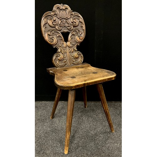 1908 - A German/Swiss Brettstuhl type carved Black Forest style hall chair, the back as the Green man blowi... 