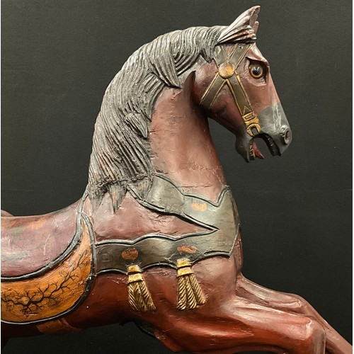 1572 - An early 20th century carved and painted Carousel horse, 105.5cm high, 104cm long,  25cm wide