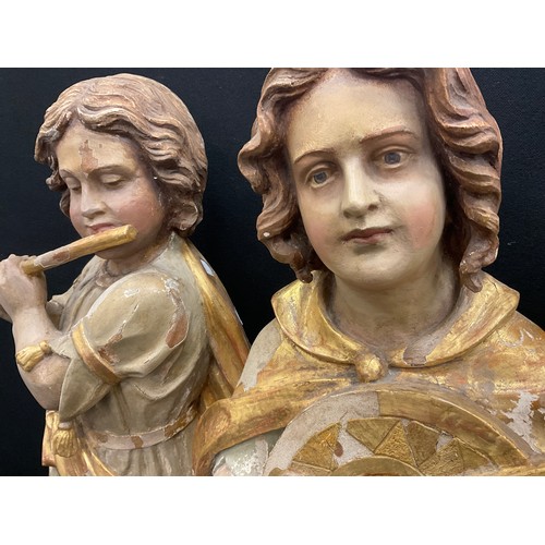 1844 - A pair of 19th century Continental polychrome figures,  standing, one playing a flute, the other a m... 