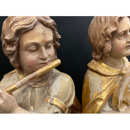 1844 - A pair of 19th century Continental polychrome figures,  standing, one playing a flute, the other a m... 