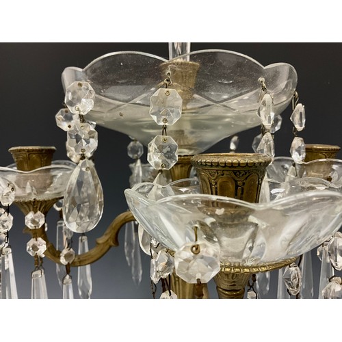 2004 - A Victorian style brass and cut glass four light candelabra epergne, central wavy rim trumpet epergn... 