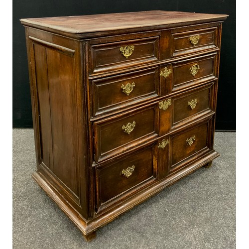 1793 - A William and Mary style oak and elm chest of drawers, four graduated long drawers with paneled fron... 