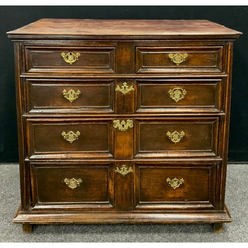 1793 - A William and Mary style oak and elm chest of drawers, four graduated long drawers with paneled fron... 