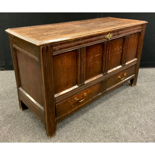 1914 - An 18th century Oak four-panel Lancashire chest, two short drawers to the base, stile feet, 73cm hig... 