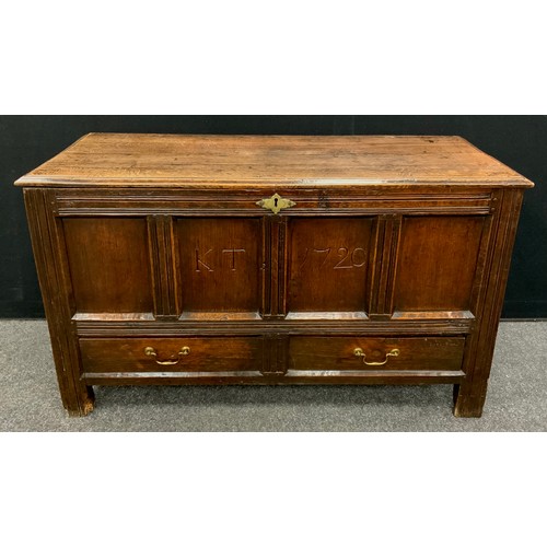 1914 - An 18th century Oak four-panel Lancashire chest, two short drawers to the base, stile feet, 73cm hig... 