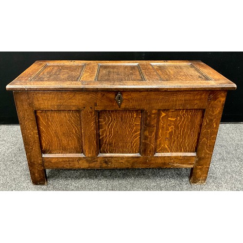 1928 - An 18th century three panel oak blanket chest, 61cm high, 103cm wide, 45cm deep